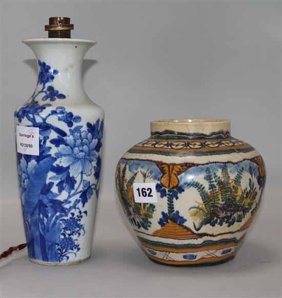 A Chinese porcelain vase, blue and white, with birds in peony trees, fitted as a table lamp and an Italian maiolica jar, Blue vase H.26